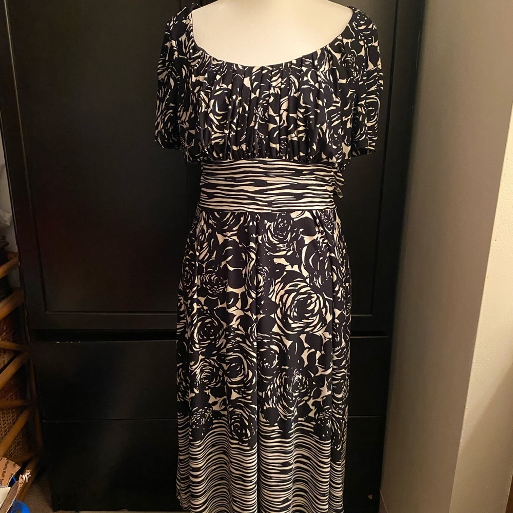 Knee length dress, stylish with a nice shell.  Cute for a party or work